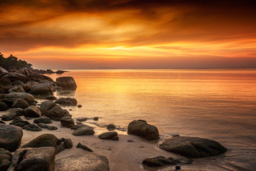 A beautiful rocky beach at sunset