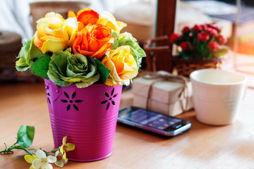 Colorful roses on the desk.