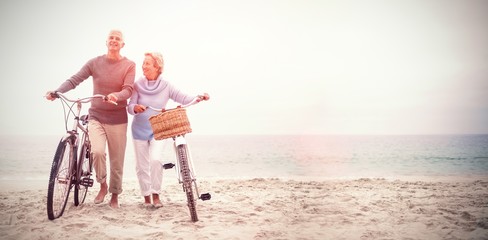 Senior couple with their bicycles - Powered by Adobe