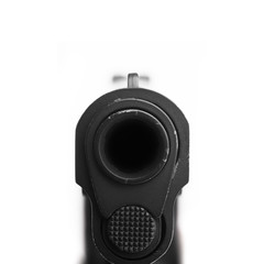 pistol pointing at a camera. Isolated on white background.