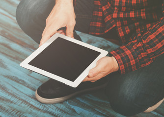 White tablet with copy space in male hands