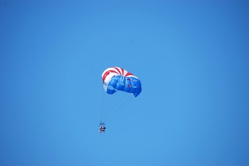 parasailing in flight with three passengers