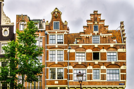 Historic houses with Bell Gable and Step Gable dating back to the Middle Ages along the canals of Amsterdam