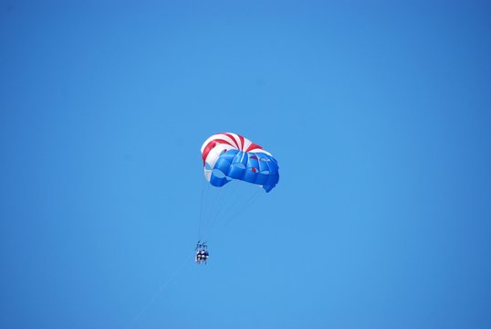 parasailing in flight with three passengers