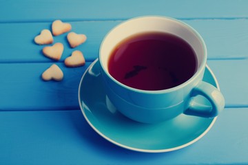 Cup of tea with cookies for Valentine's day.