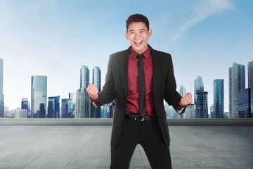 Young asian businessman with happy expression