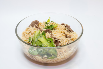 delicious instant noodle in bowl on white background