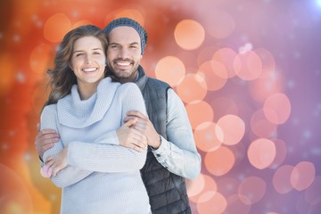 Composite image of happy couple embracing each other