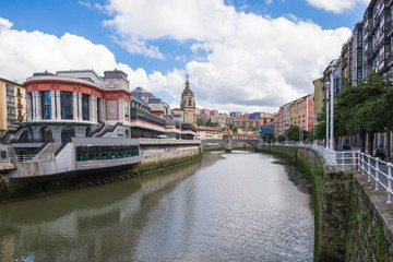 House facades in Bilbao along the Nervion river that runs through the city into the Cantabrian Sea. The apartment blocks are situated in the district San Frantzisko, on left the Mercado de la Ribera