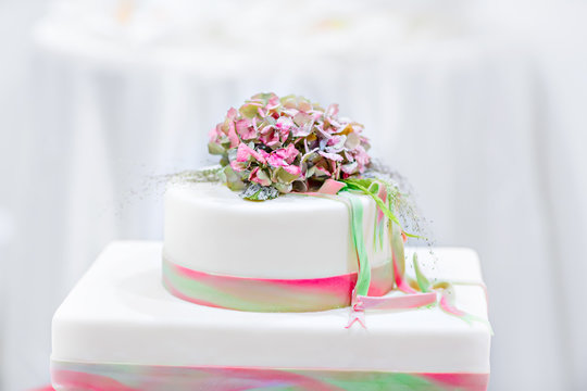 Wedding cake in white, green and rose 