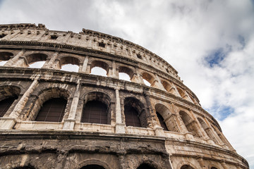 Naklejka premium Cloudy view of ancient amphitheater Colosseo in Rome, Lazio region, Italy.