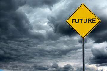 road warning sign with text future in front of storm cloud background