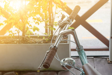 Handlebar of a bicycle on natural bokeh background. Travel and e