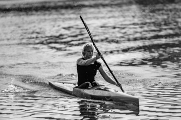 Female Kayaker training on lake