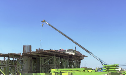 crane move material at bridge construction site