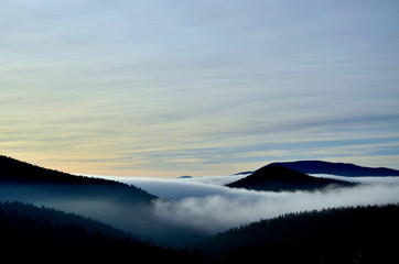 Low laying clouds in a mountain valley