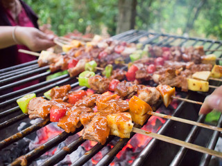 Bar-B-Q or BBQ with kebab cooking. coal grill of pock meat skewe