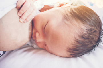 Obraz na płótnie Canvas Newborn child breastfeeding from mom.