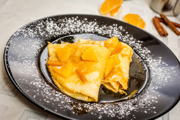 Pancakes with oranges