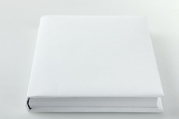 Front view of Blank book cover white on gray background.