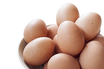 Eggs cooking for breakfast, a protein form yolk and albumen on a white background, or on a plain wooden table.