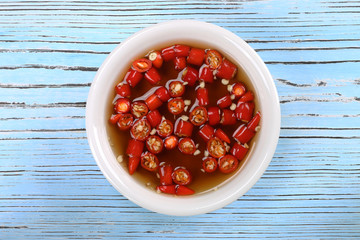 Fish sauce with chili in white bowl