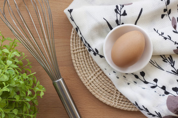 Eggs cooking for breakfast, a protein form yolk and albumen on a white background, or on a plain wooden table.