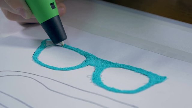 3D pen making real glasses with plastic. Innovative production technology in work. 4K.