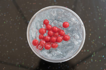 Closeup strawberry italian soda with ice and jelly ball