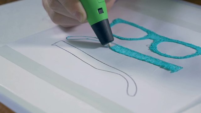 Printing with Plastic Wire Filament. 3D pen in work. 4K.