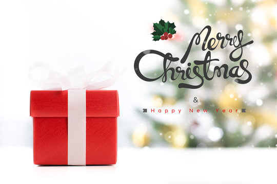 Gift box with Merry Christmas and Happy New Year text