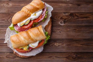 Appetizing baguette with sausage ,vegetables