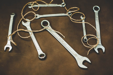 Wrenches on a brown background
