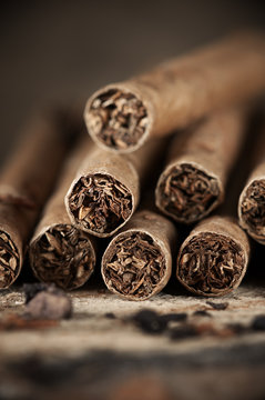 Cigars pile on wood