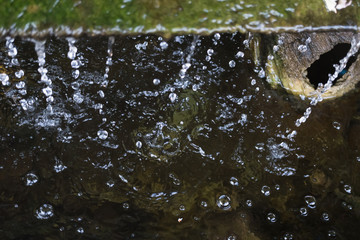 Small artificial waterfall in the garden