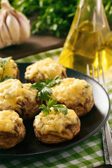 Baked mushroom caps stuffed with creams cheese, garlic and herbs.