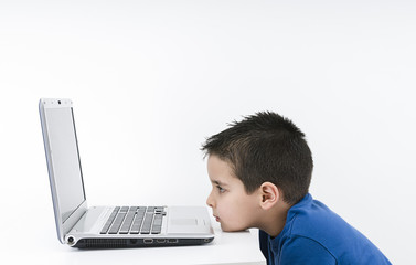 Child Looks at Laptop Isolated