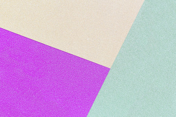 background of the three colors green, purple and yellow shiny paper.