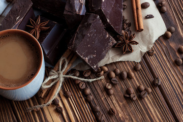 cup of cofee with milk.dark chocolate with cinnamon and star ani