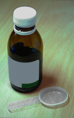 Cough syrup isolated on wooden
