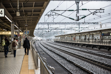 View of the Shin Yokohama railway station in Japan, which is operated by Central Japan Railway Company and is a very important transportation hub. People are seen waiting for trains.