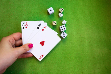 cards and dice on green background