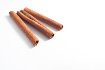 Cinnamon sticks on white background.