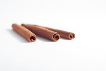 Cinnamon sticks on white background.