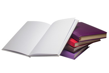 Five notebooks notebooks with different covers are located on a white, isolated background.