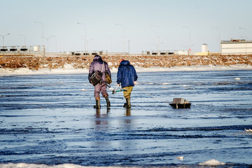 winter fishing on the sea the bright sun