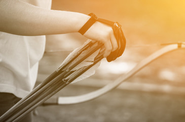 Athlete aiming at a target and shoots an arrow. Archery.