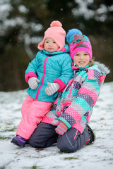 Two little girls on winter walk.