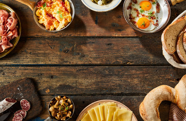 Border of savory german dishes on rustic table