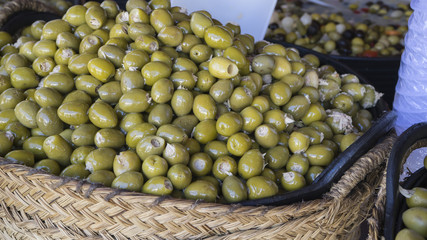 Olives stuffed with anchovy, typical Spanish food, pickles in vi